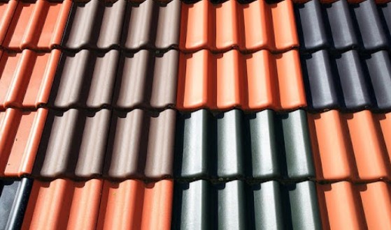 image of concrete barrel shaped tiles in orange, brown, and gray