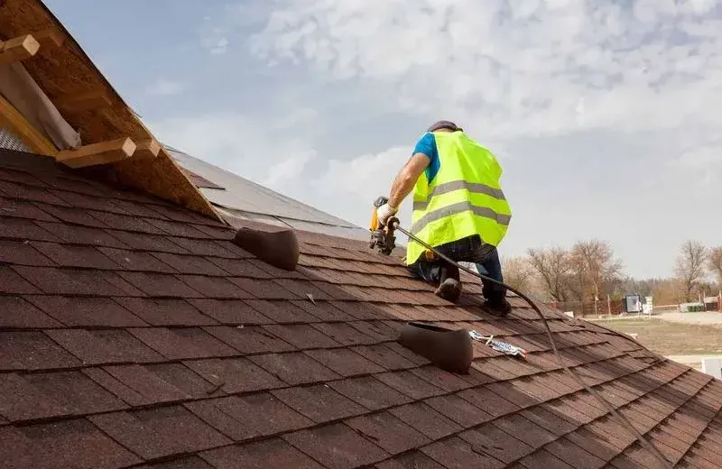HOW ASPHALT ROOFING IMPROVES YOUR HOME'S VALUE IN SAN DIEGO 3 62ced74345e2db3663fdd1ae roof worker on asphalt roof p 800
